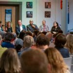 Panel discussion in front of a small audience
