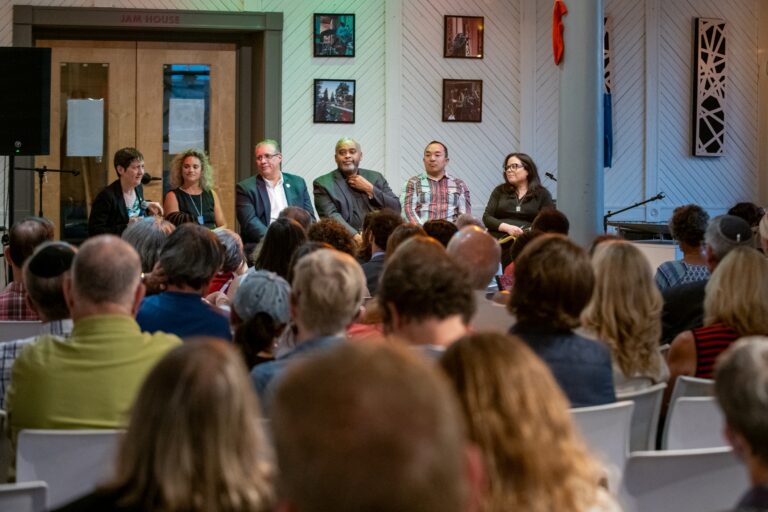 Panel discussion in front of a small audience