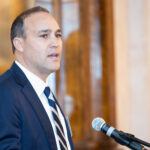 Young man speaking at a podium