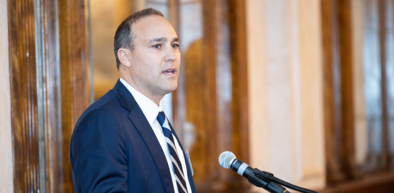 Young man speaking at a podium