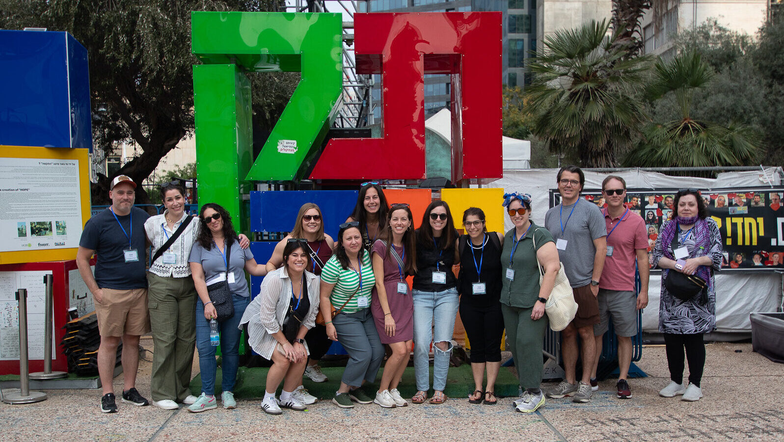 Group of young adults standing in front of a statue in Israel