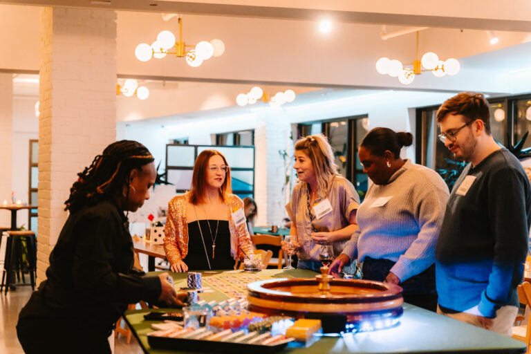 A group of young professionals at a roulette table