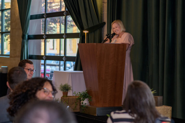young woman at podium