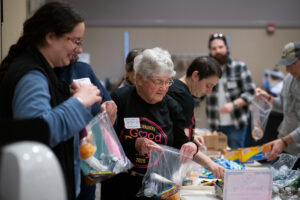 Community members volunteering on Good Deeds Day