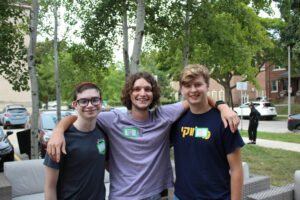 A small group of young college students arm in arm