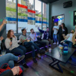 Group of people singing at a karaoke bar