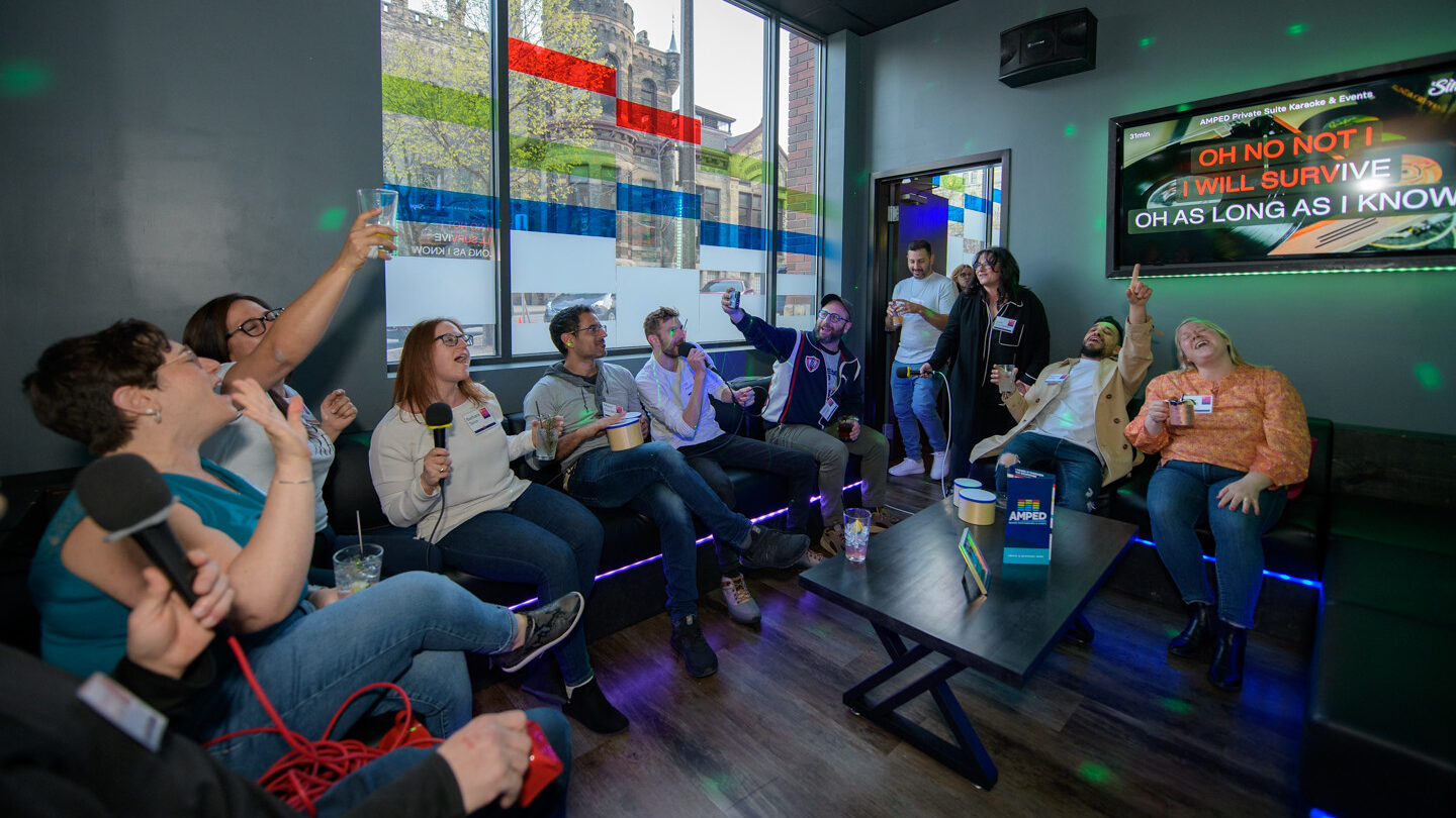 Group of people singing at a karaoke bar