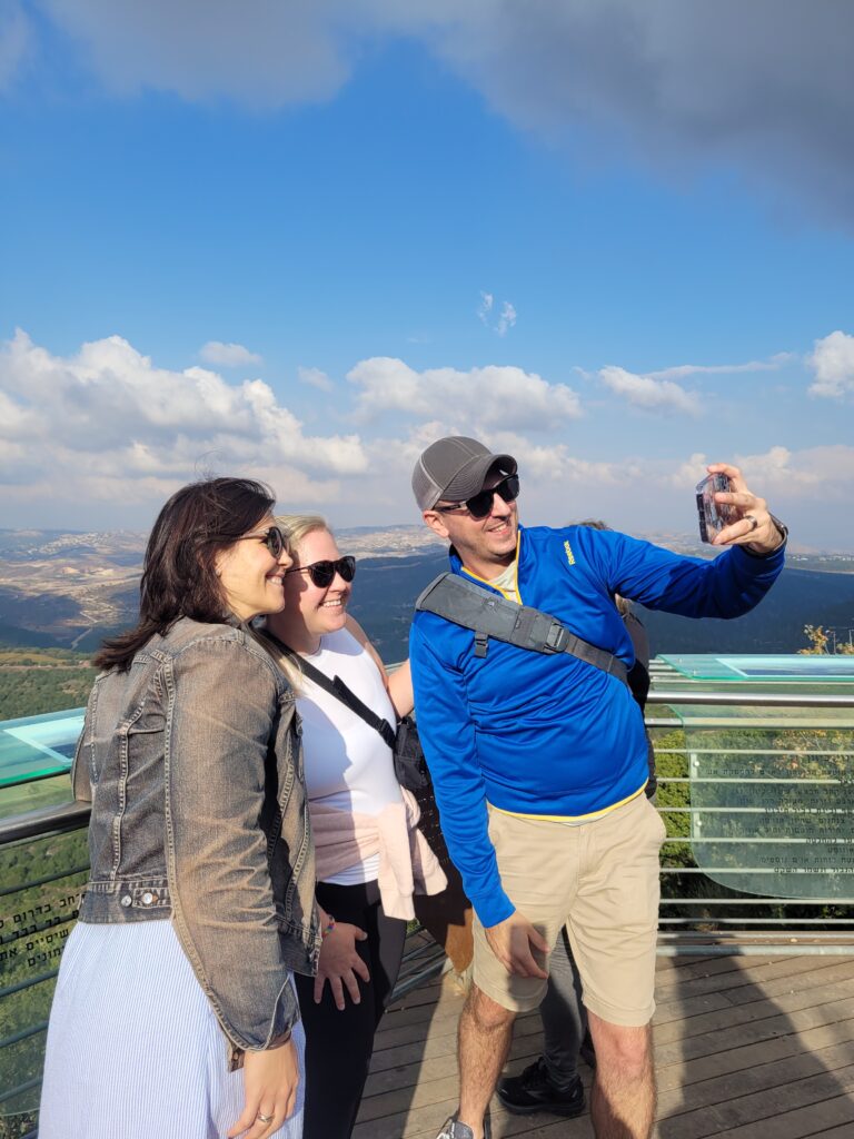 group of young adult tourists taking a selfie