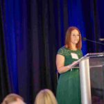 Young woman standing at a podium