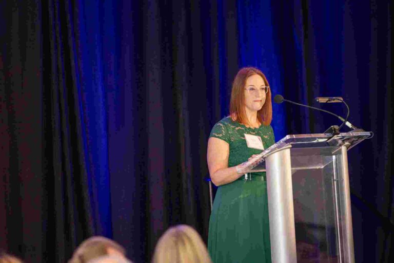 Young woman standing at a podium
