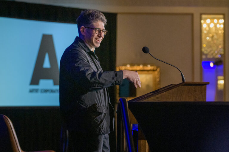 A man speaking at a podium