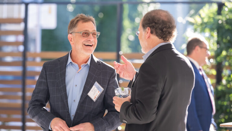 Two men networking at an event