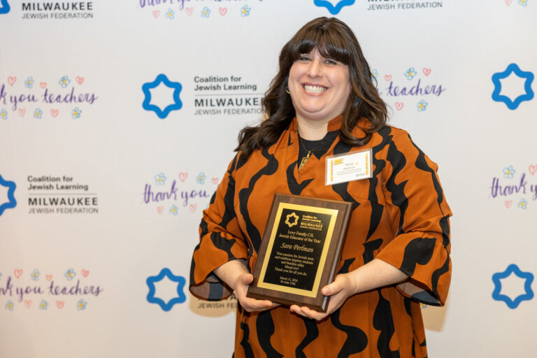 woman holding an award