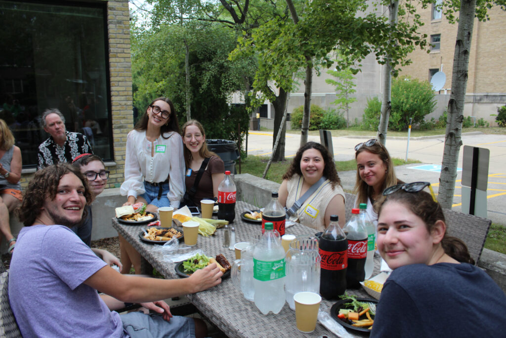 A group of college students sitting outside