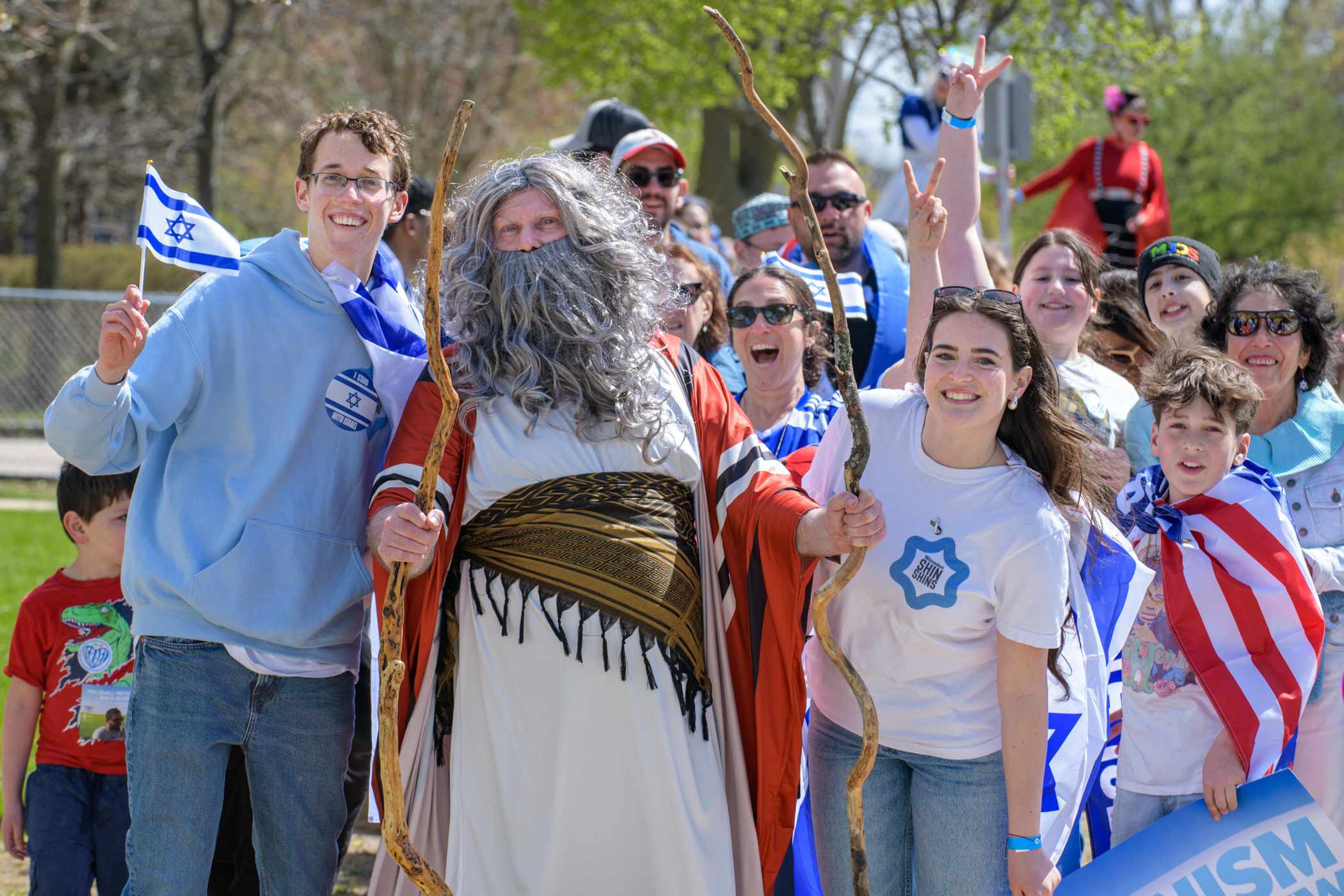 Group of happy people posing for photo at Walk for Israel event.
