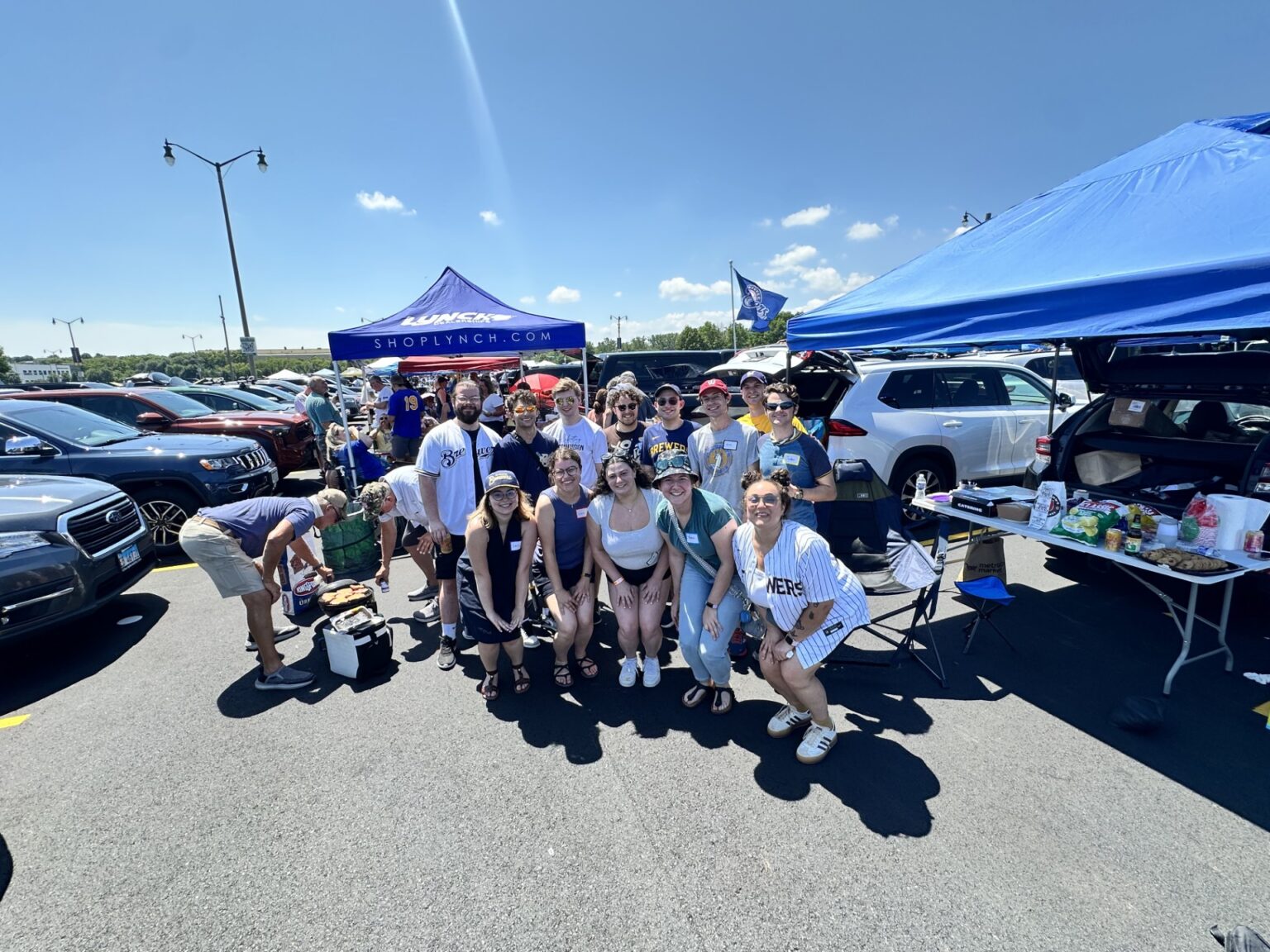 group of young adults tailgating at a Brewers game