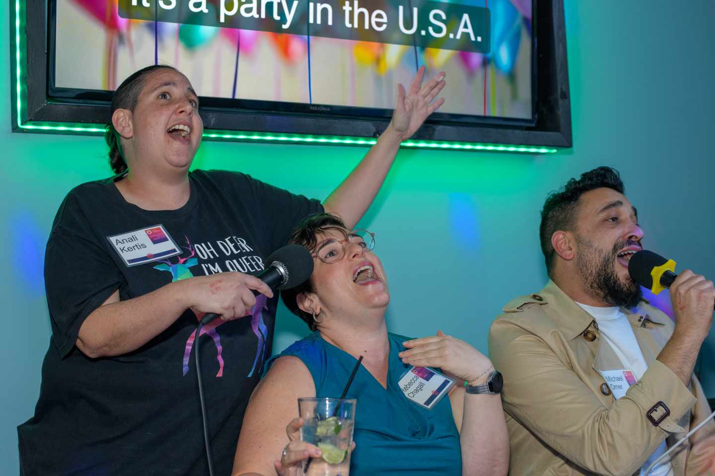 A group singing karaoke.