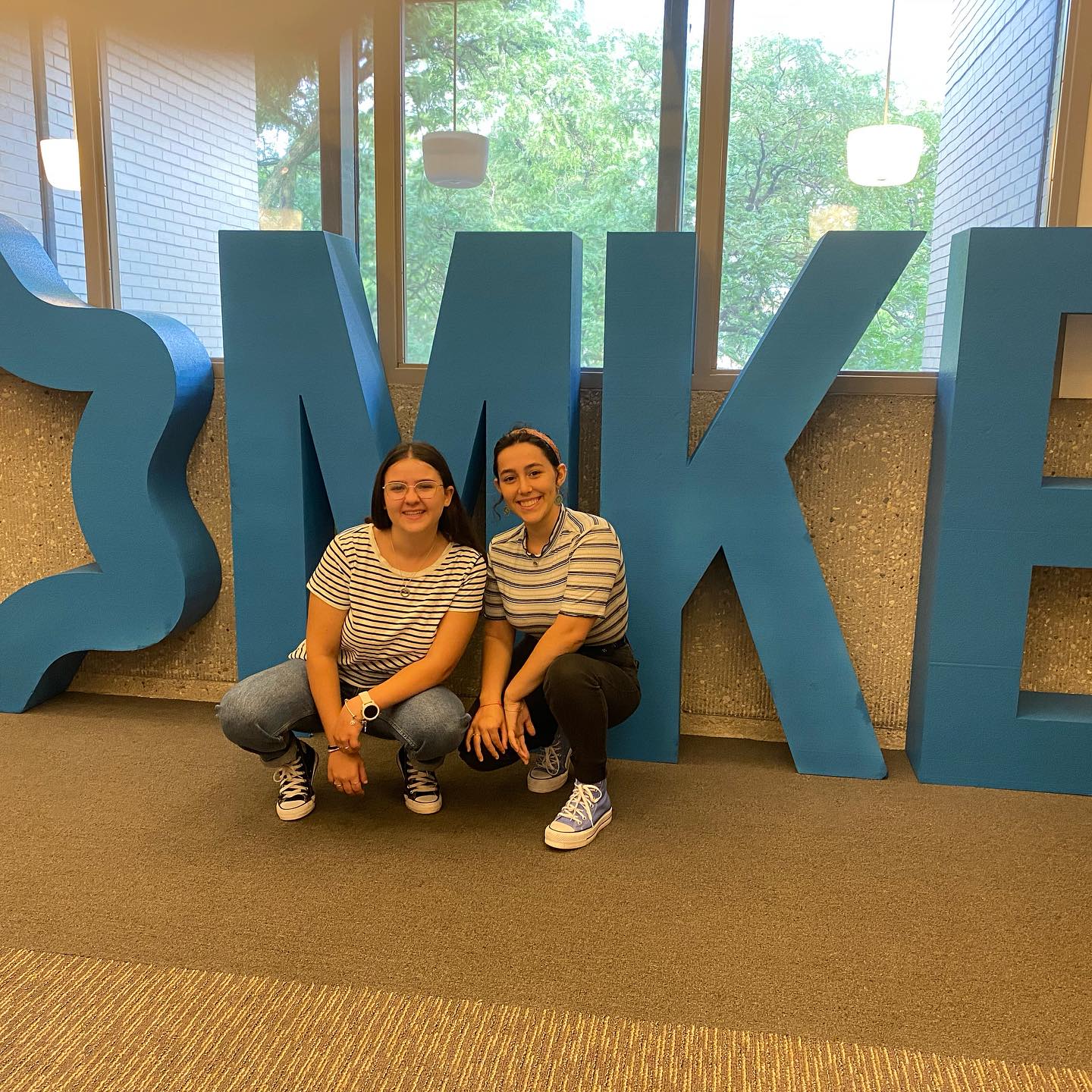 Two girls smiling