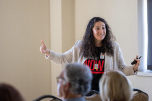 a woman speaking in front of audience