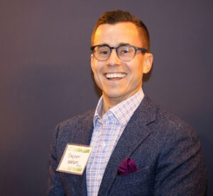 Man in suit smiling