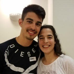 young woman and man smiling