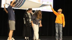 High school students completing Jewish ritual