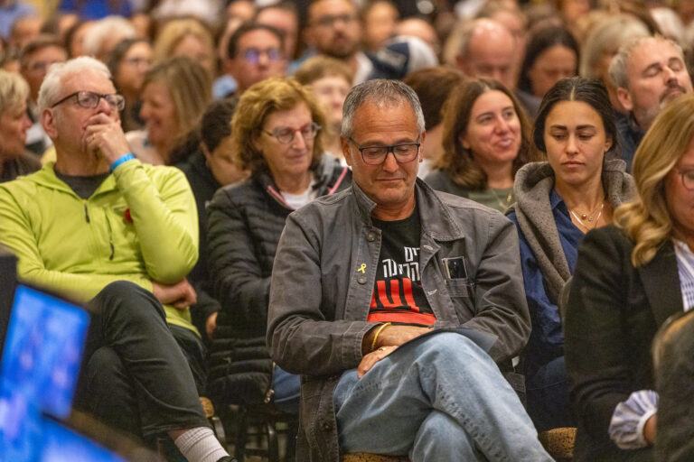 Crowd of people sitting.