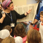 A woman teaching at a Jewish school