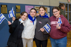 Group of teen girls with Israel flags